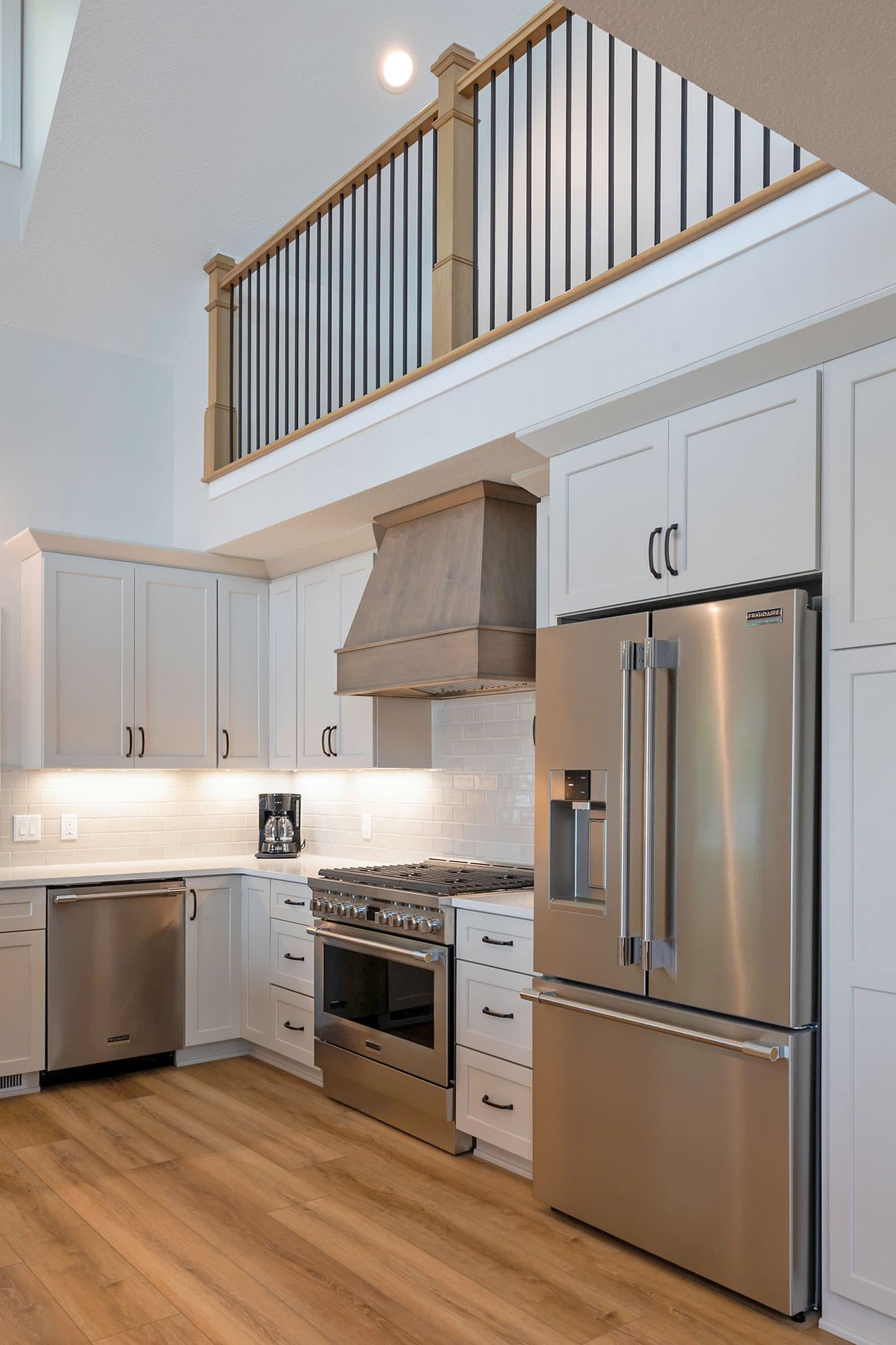 Dark vanity with sage green walls and modern chrome fixtures